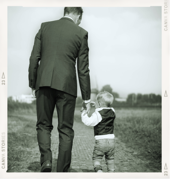 father and son walking hand-in-hand